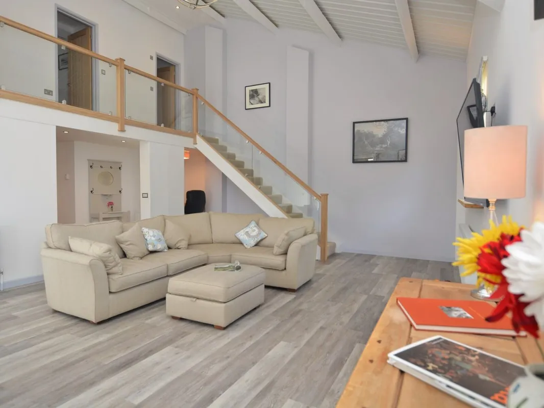 Quiet, uncluttered holiday home room with soft lighting and calm decor