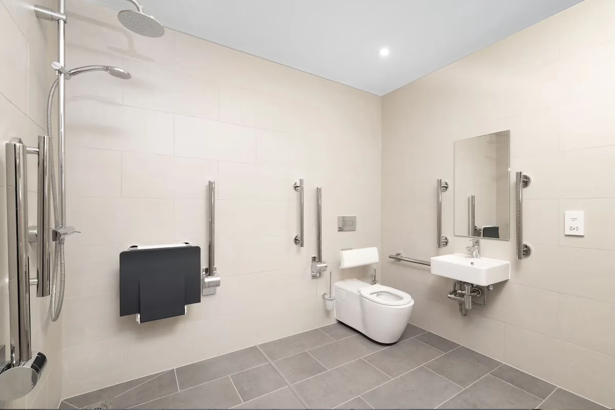 Wheelchair friendly holiday bathroom with usable space